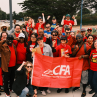 A large group of people in CFA shirts with a red cfa flag