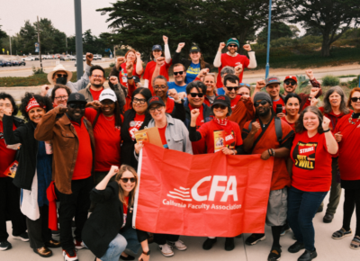 A large group of people in CFA shirts with a red cfa flag