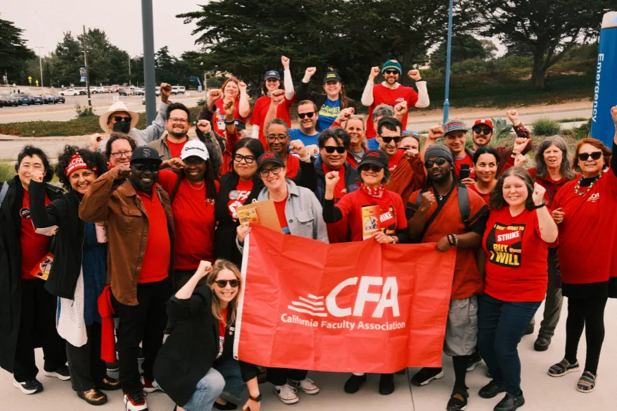A large group of people in CFA shirts with a red cfa flag
