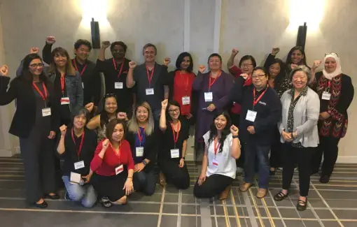 CFA members lift their fists in solidarity.