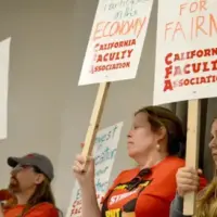 CFA Stanislaus members rally and carry signs in support of fair wages.