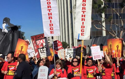 Large group of people wearing red shirts hold rally signs and white banners that read CFA Northridge.