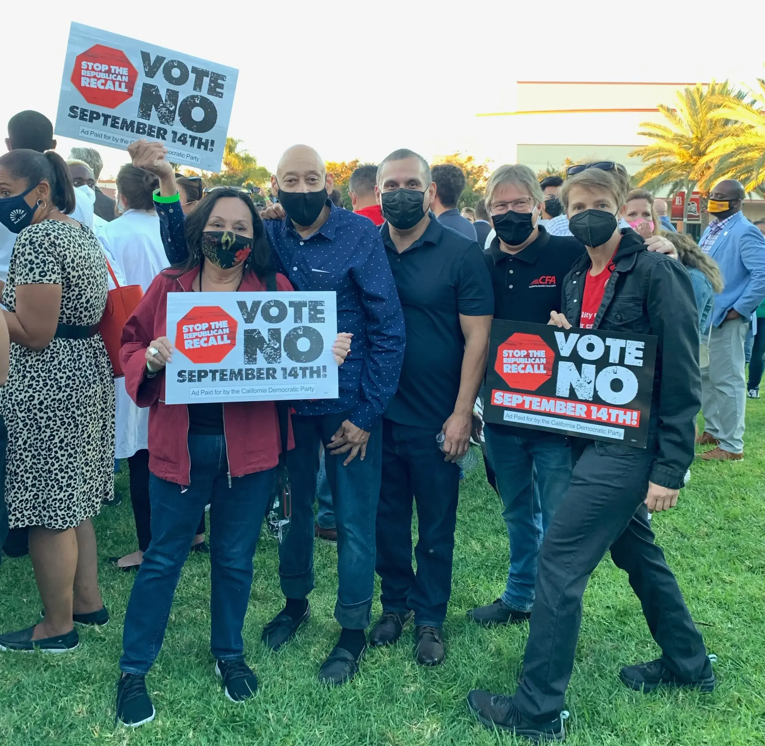 A group of people holding signs