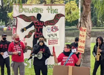 Image with group of people holding signs