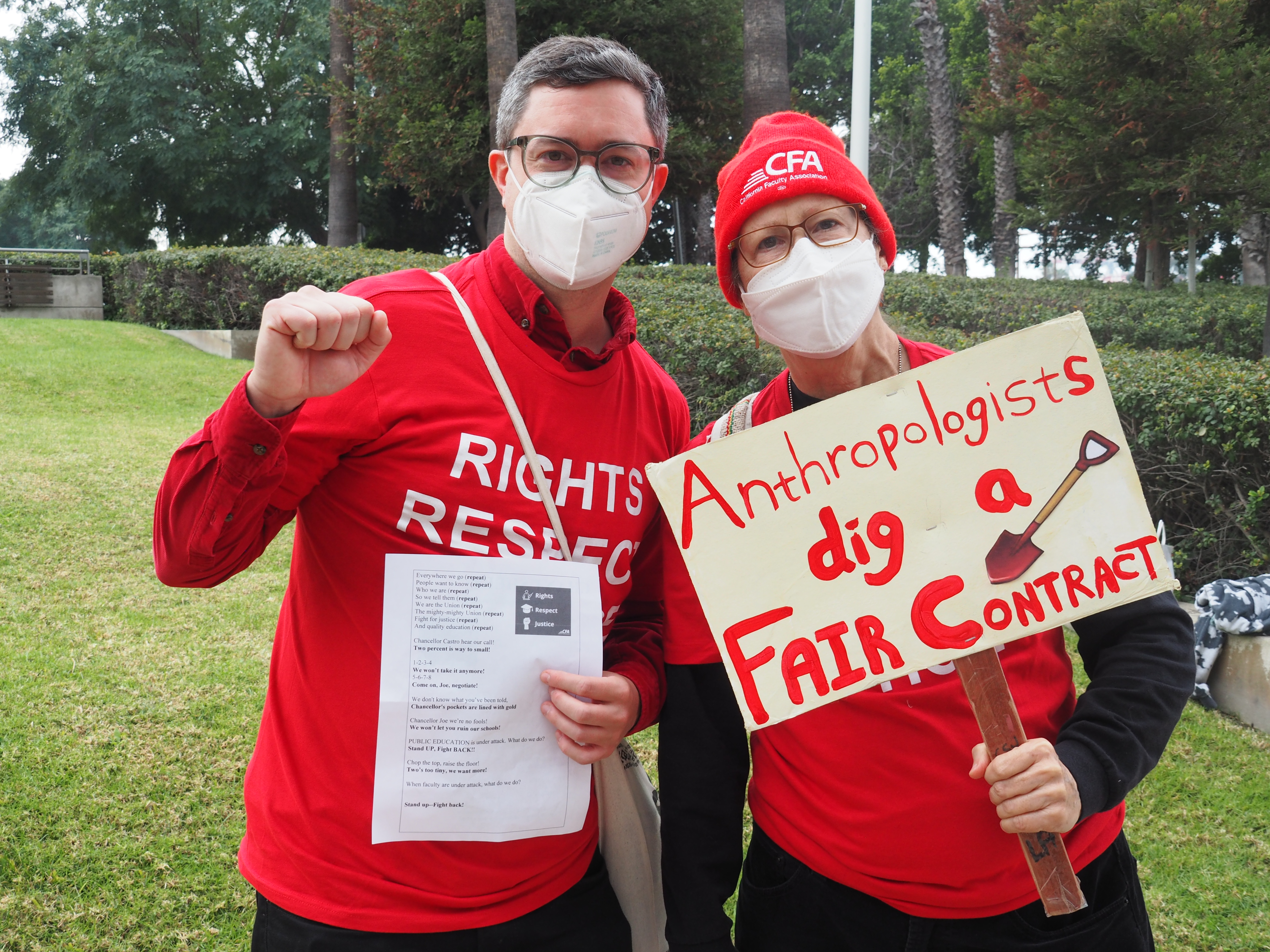 CFA members pose with signs supporting a fair contract.