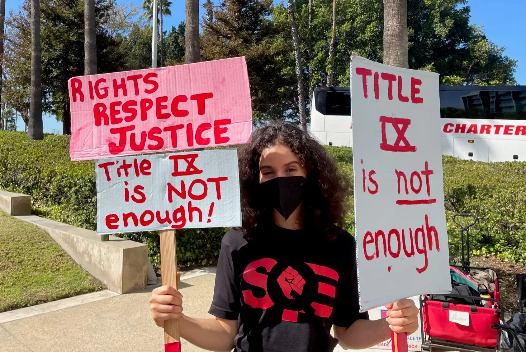 A person holding signs