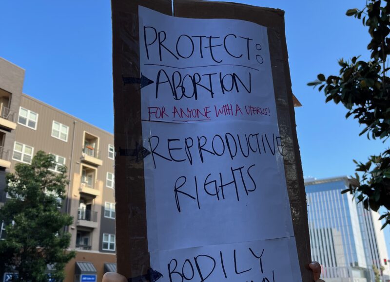 a person holding up a sign