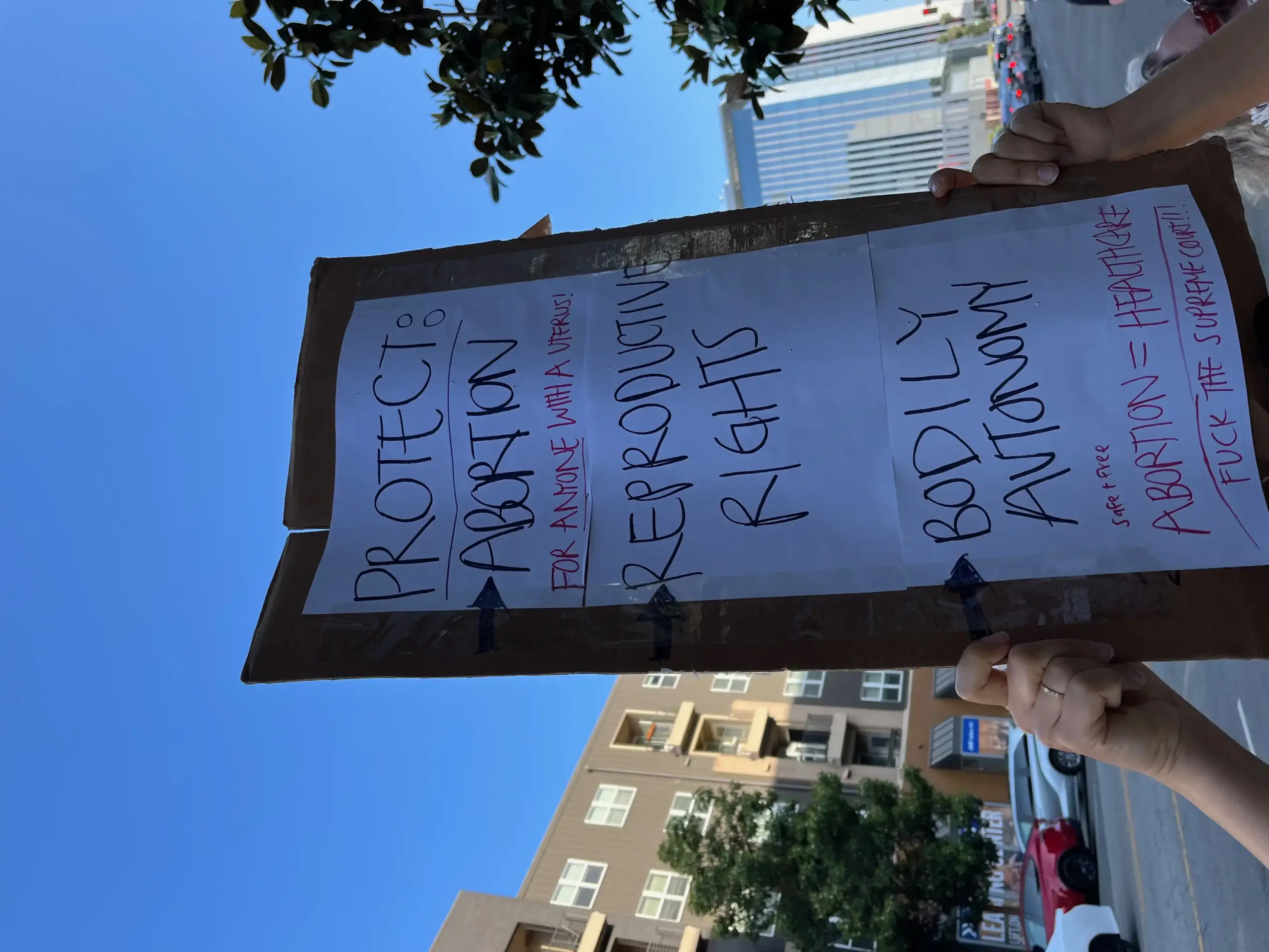 a person holding up a sign