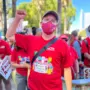 Man in red t-shirt with fist in the air