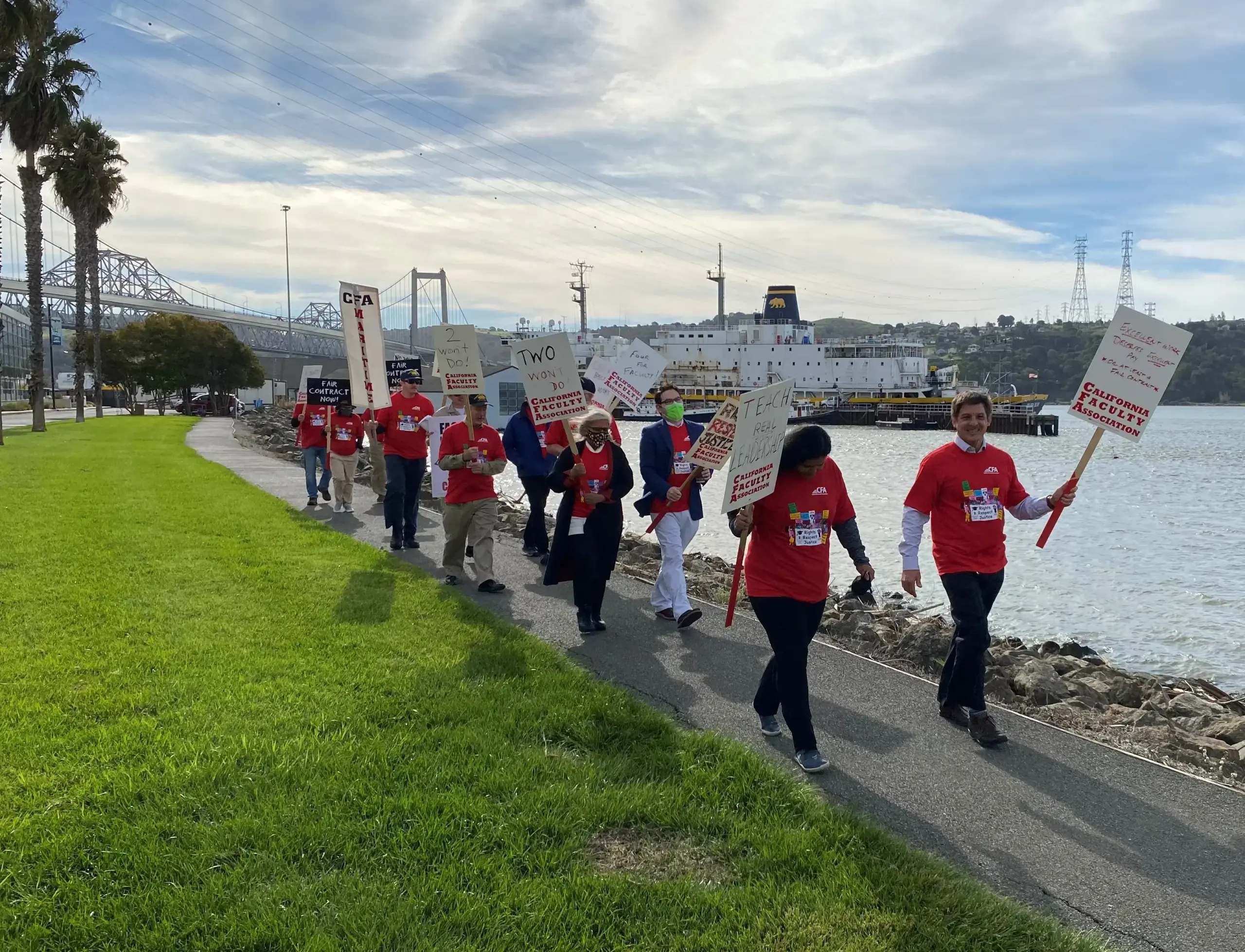 A group of people marching with signs.