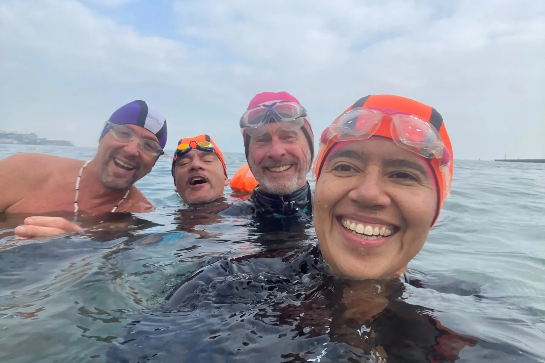 People swimming in open water