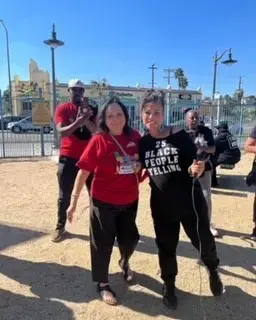 Two women pose together for a picture.