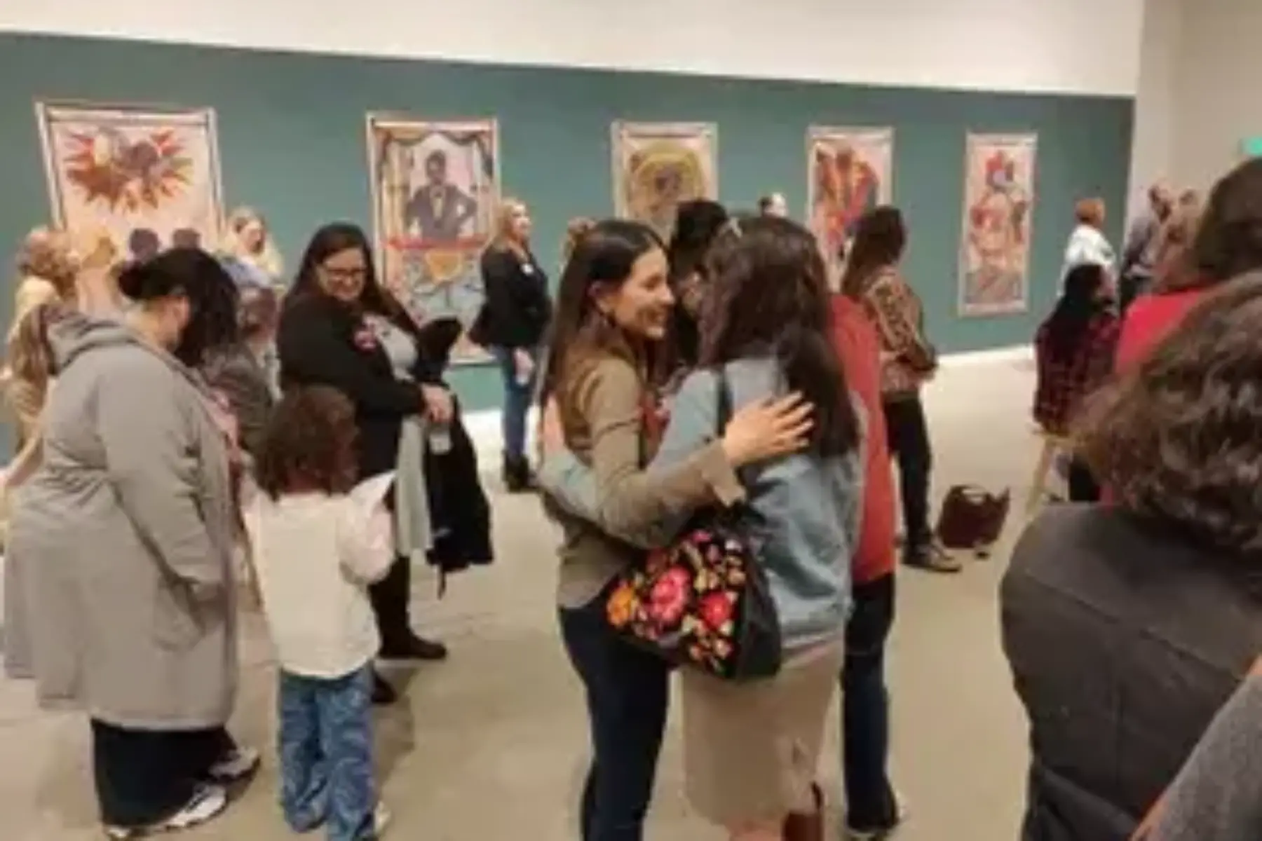 A group of people at an art event
