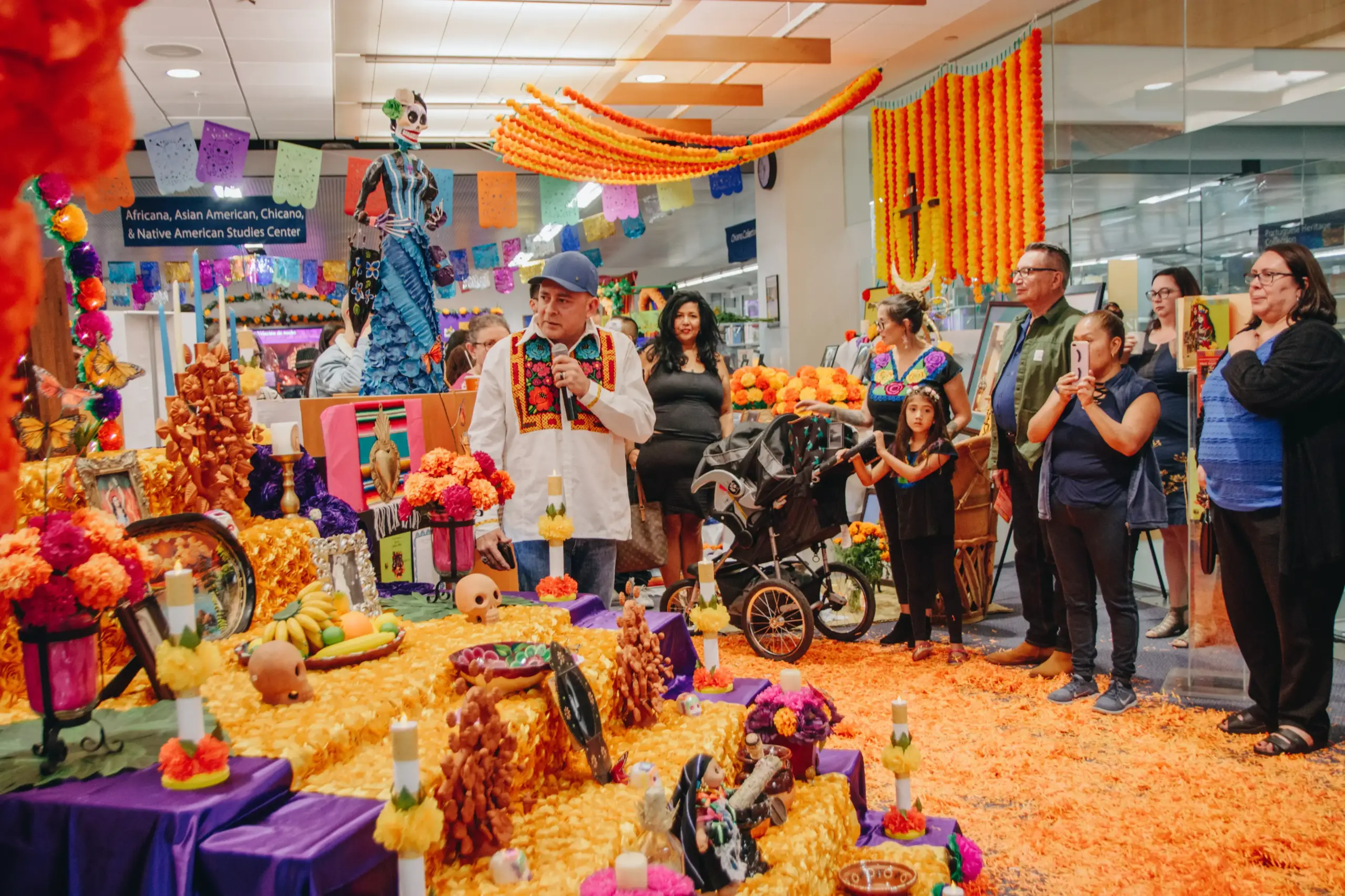 A group of people at a Dia De Los Muertos Celebration.