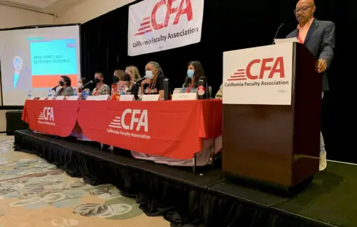 CFA President Charles Toombs speaking at the podium.