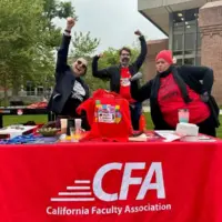 Three CFA members in red tshirts outside