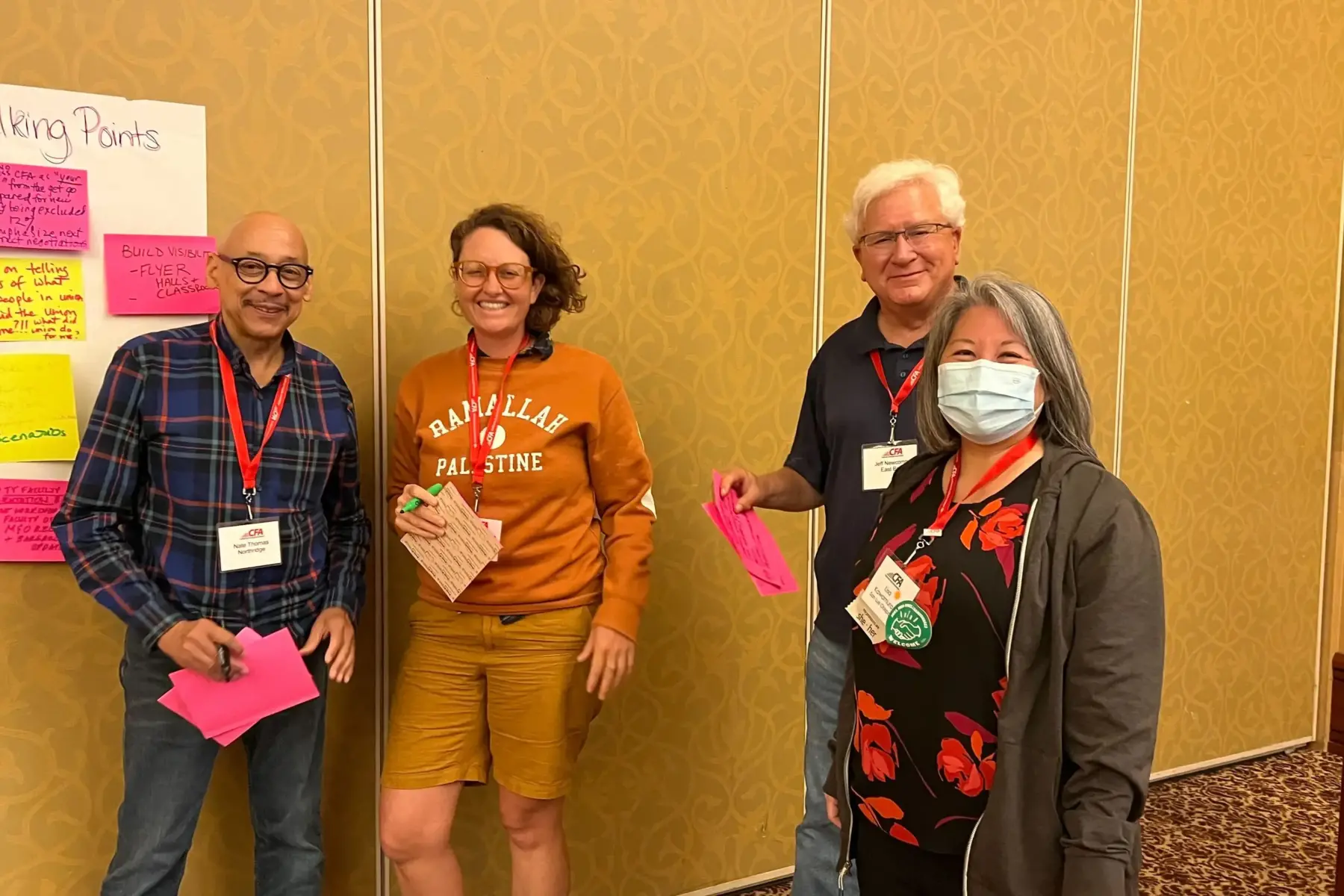 a group of people with sticky notes in a workshop