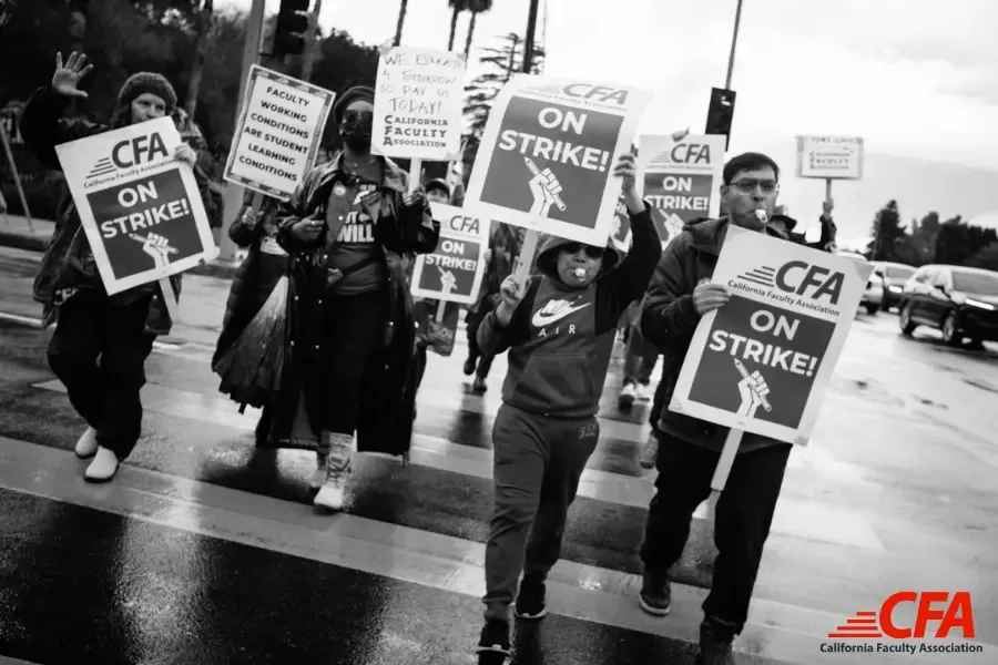 CFA members marching up and down the picket lines with CFA on Strike signs.