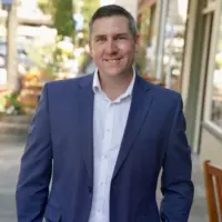 AD Candidate Chris Rogers posing in blue blazer