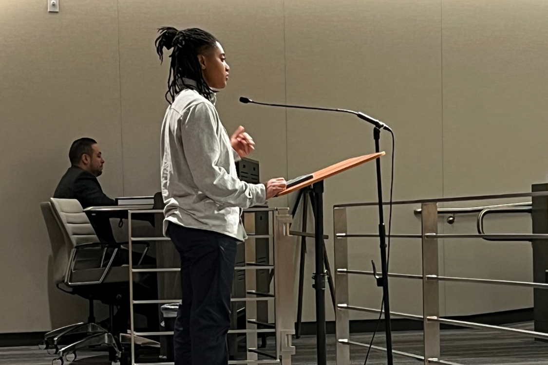 A student standing at a podium.