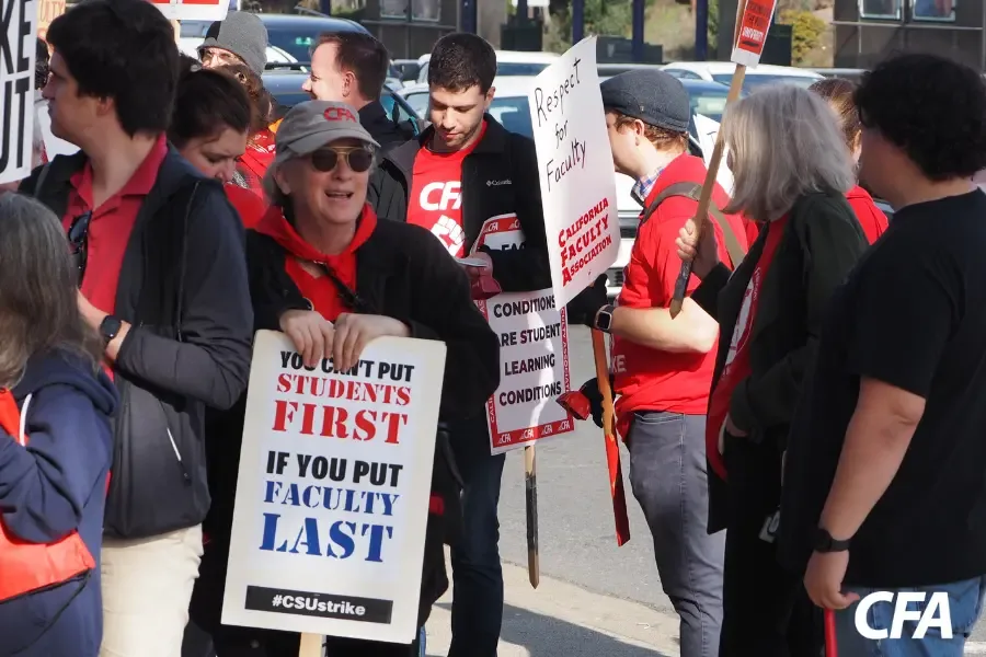 A group of people with signs