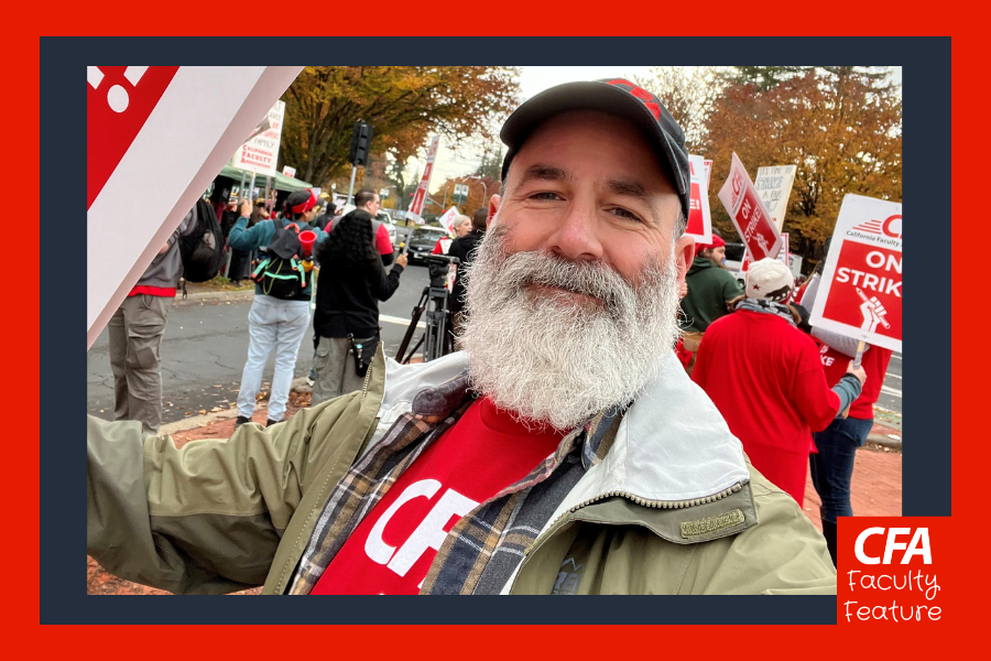 Man with a salt and pepper beard in CFA tshirt and hat at the picket lines.