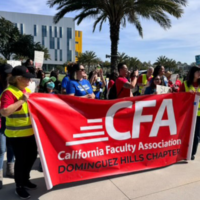 Group of members and students rallying holding a CFA banner oudoors.