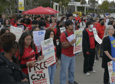 Group of activists outdoors with signs