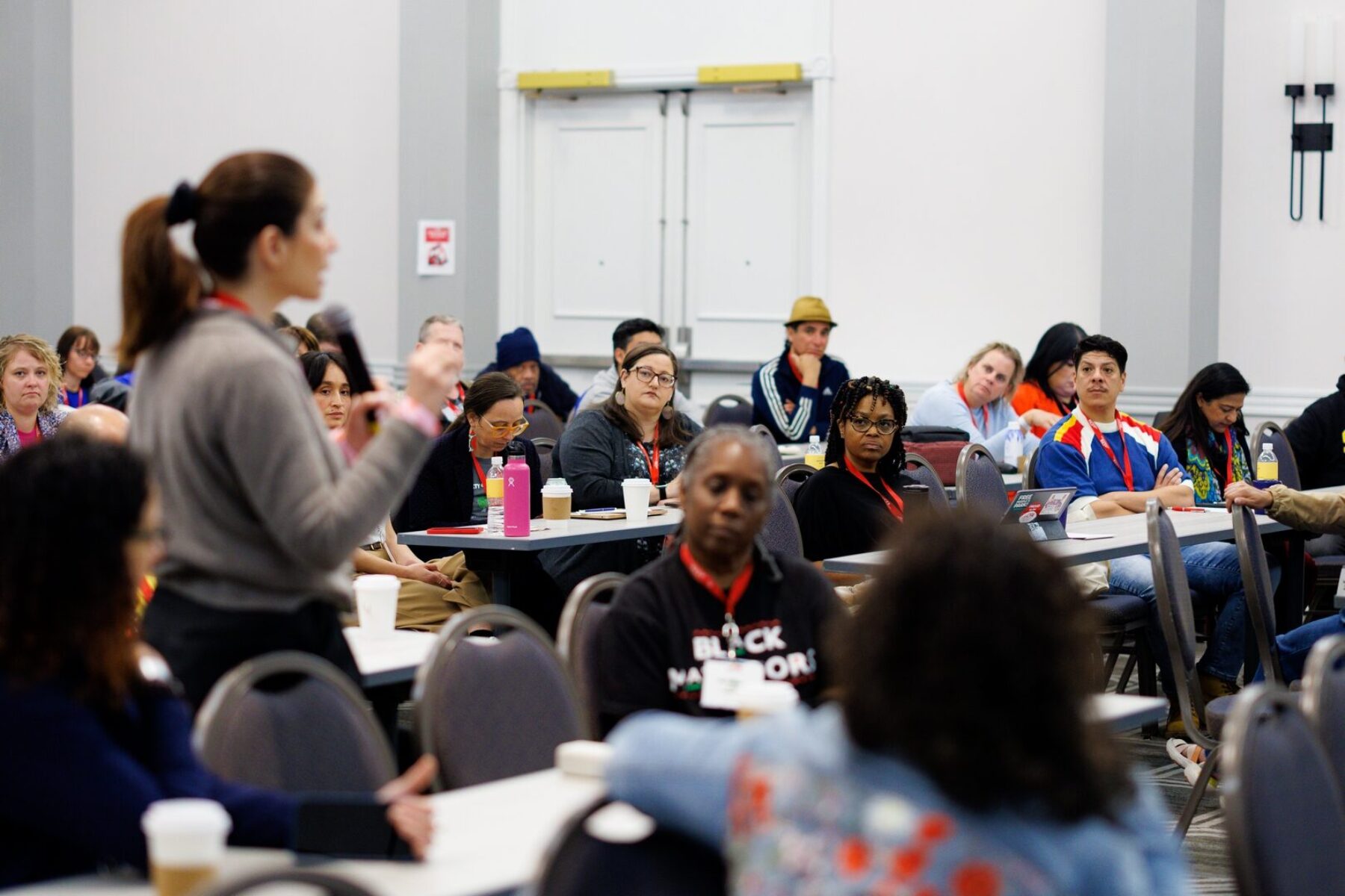 a group of people listening to a speaker