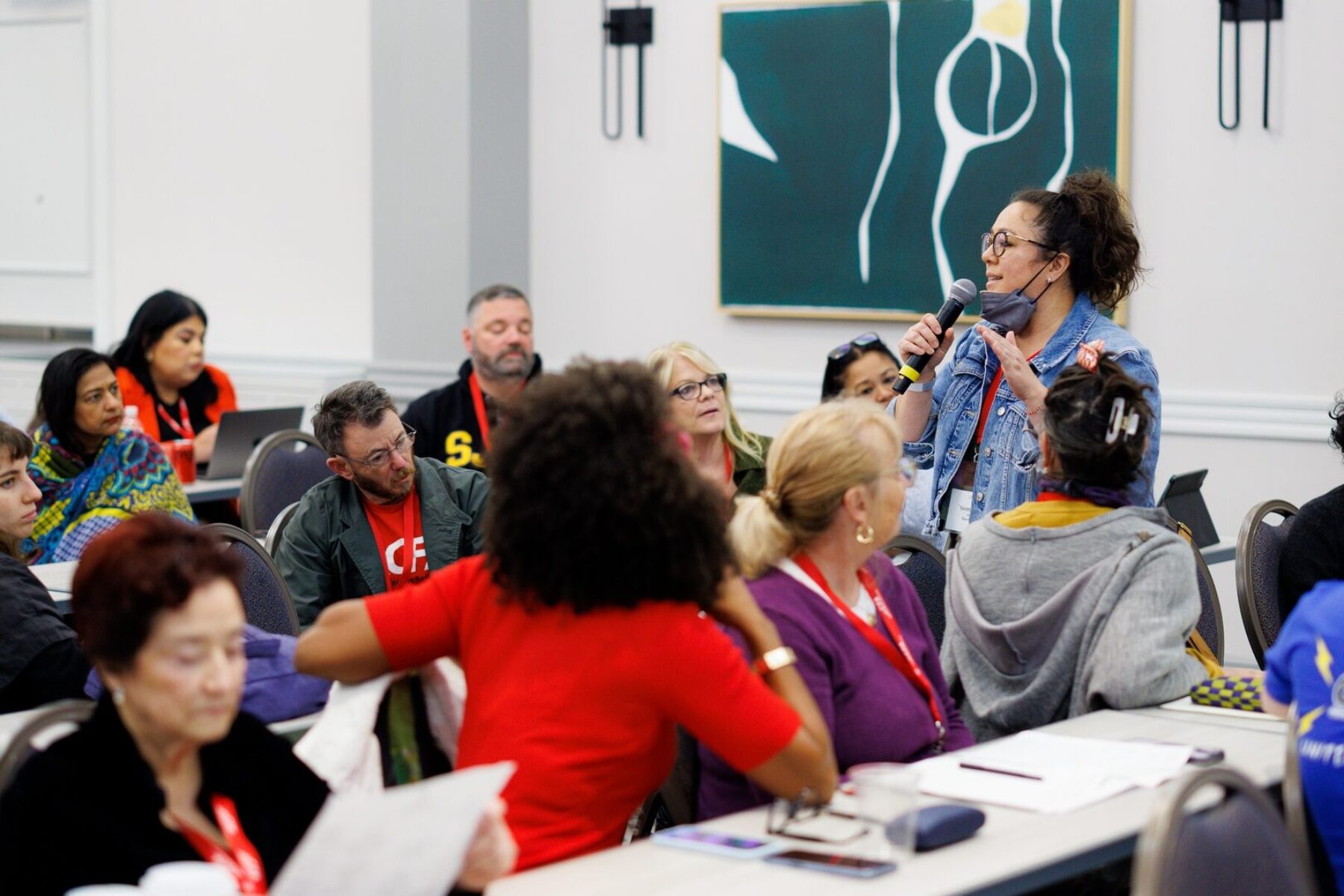 a group of people listening to a speaker