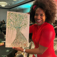 person holding tree picture