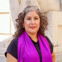 Profile picture of Janeth Rodriguez in a black top and purple scarf