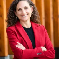 candidate in black shirt and red blazer