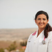 candidate in white dr coat and pink stethescope