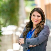 candidate in grey suit jacket and blue shirt