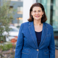 candidate in blue jacket and black shirt