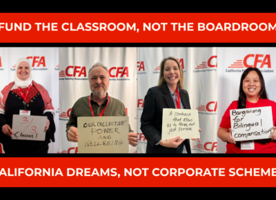 Faculty hold up white boards on what they are bargaining for.