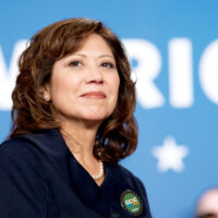 candidate in dark blue shirt