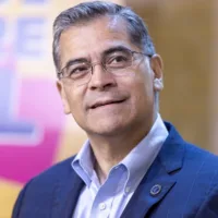 Candidate in blue suit and glasses