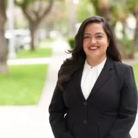 candidate in black suit and white shirt
