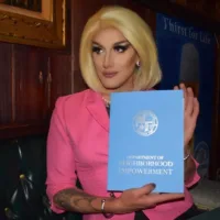 candidate in pink suit jacket