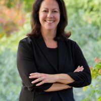 candidate with black shirt and crossed arms