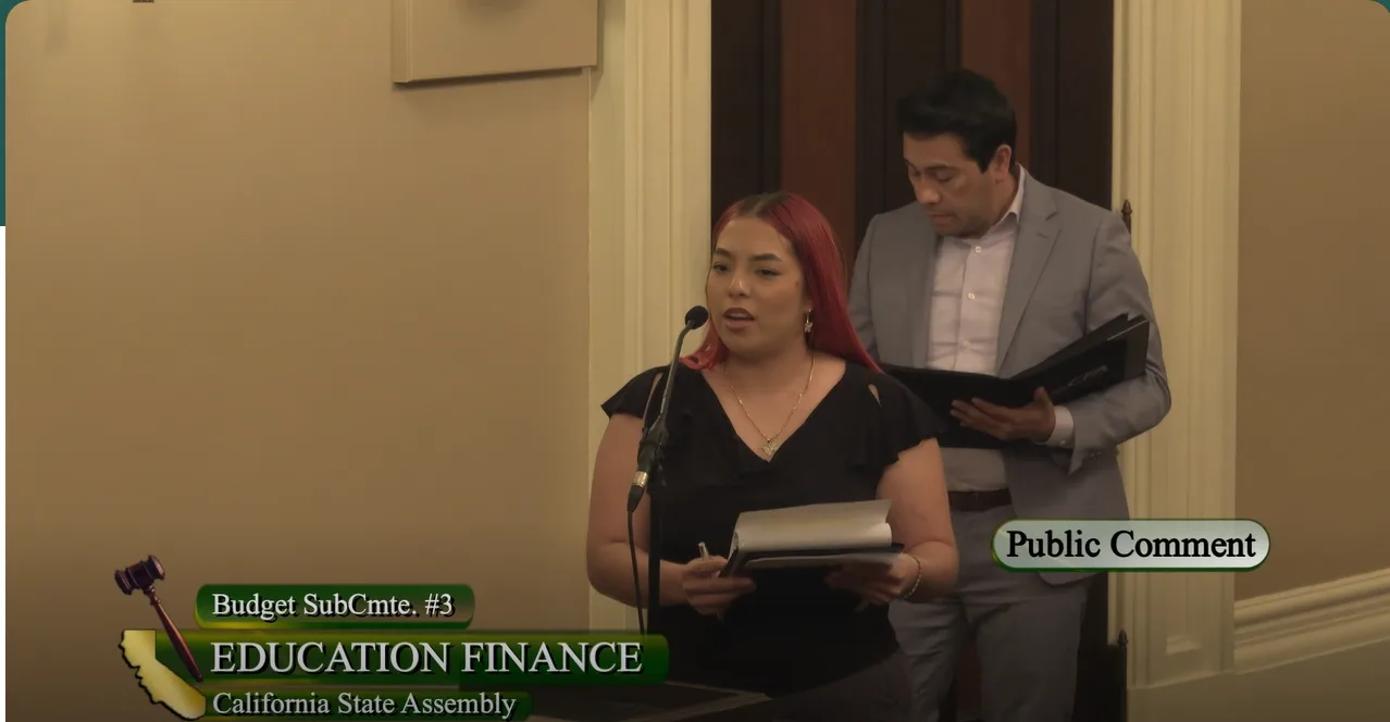 a student speaking at budget hearing