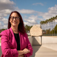 candidate in pink suit jacket