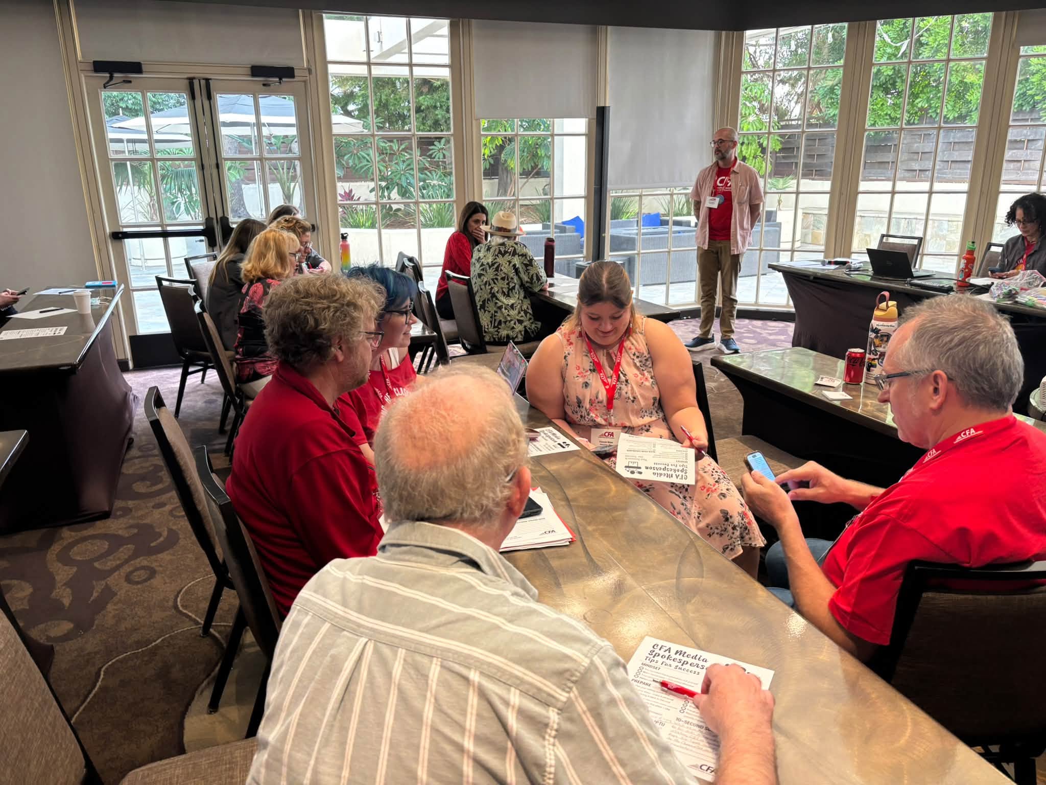 A group of people sit together for a discussion.
